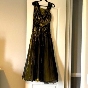 Anna Molinari Black Gold Gown with high slits.